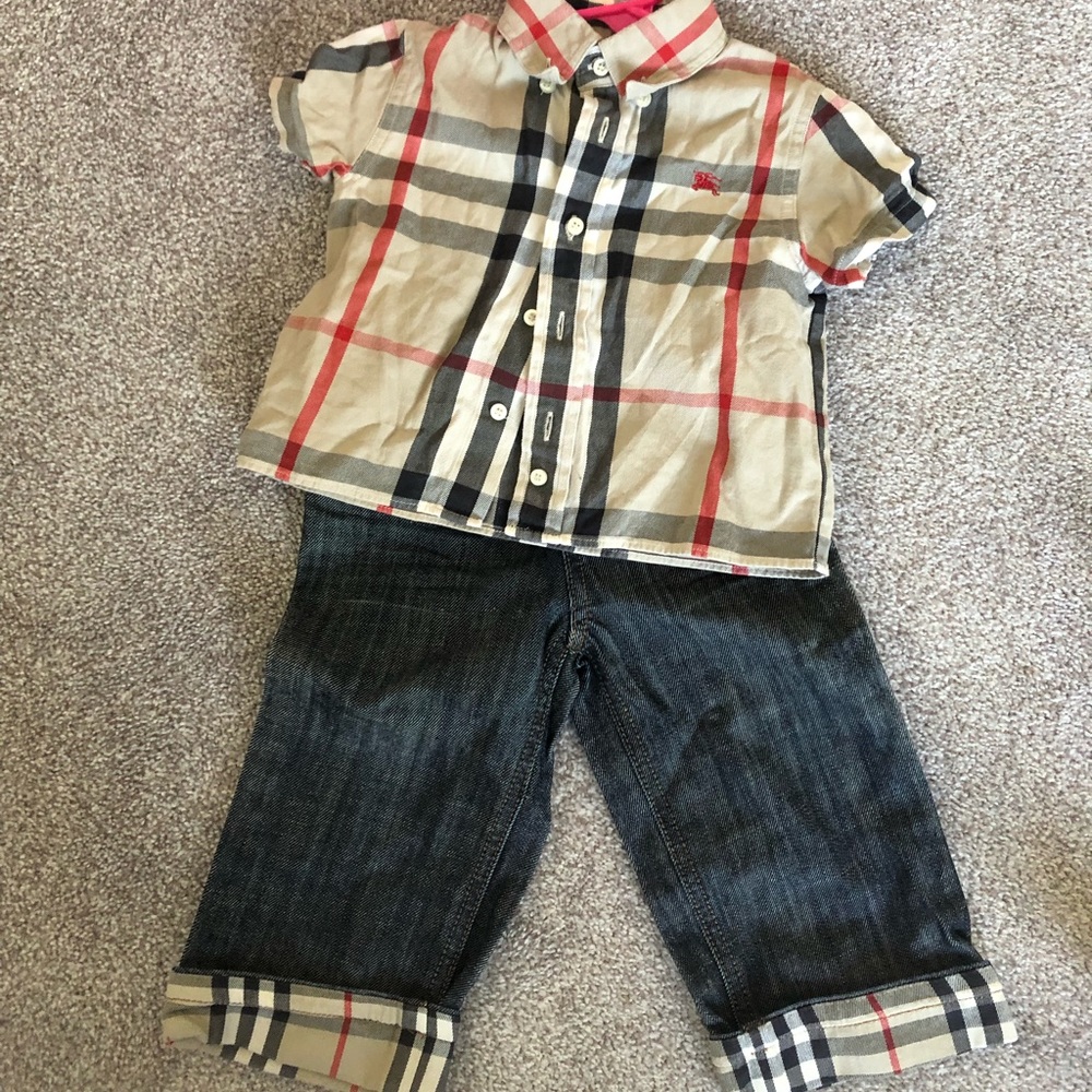 Burberry shirt and jeans.